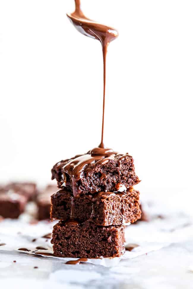 brownie with chocolate dripping over it from above